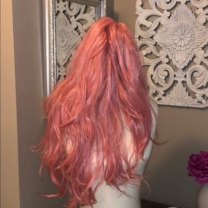 Long, soft pink wig.